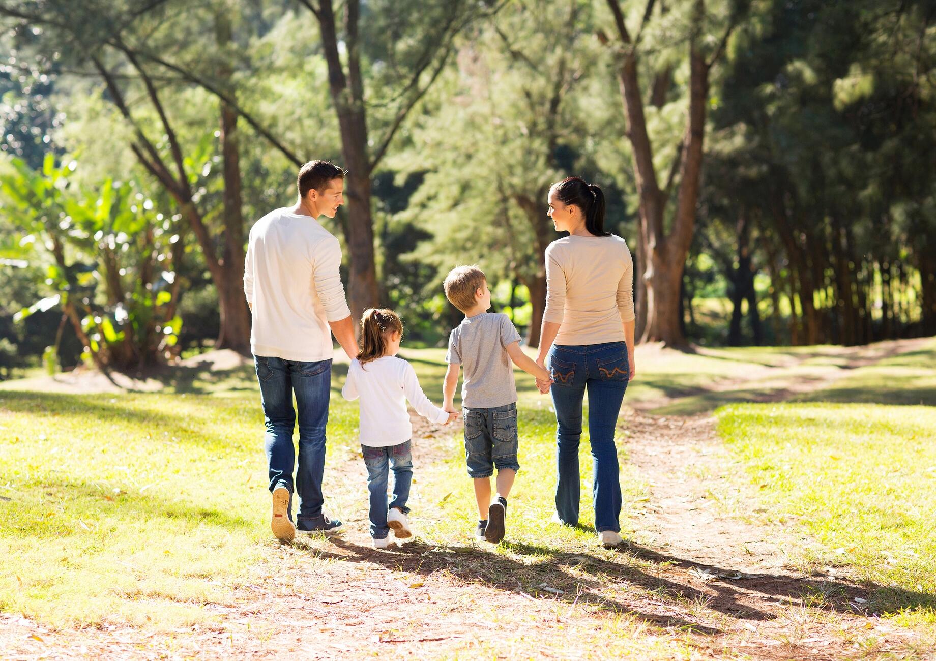 Family walking in sunshine