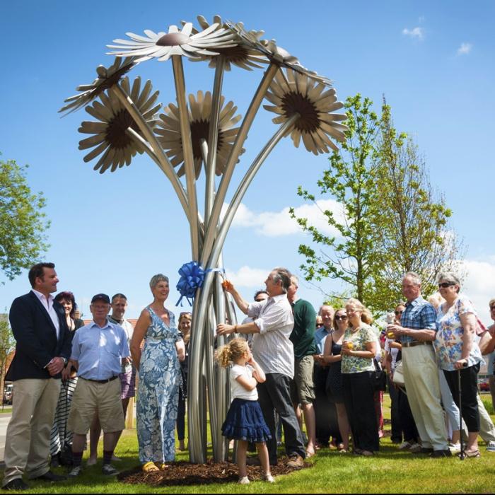 Group of people at the launch of a scupture