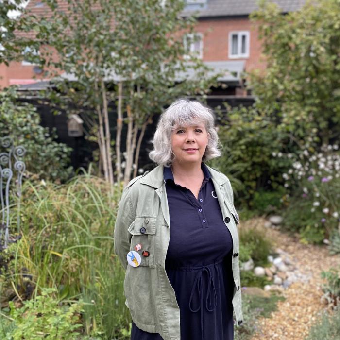 A homeowner pictured in her wildlife garden