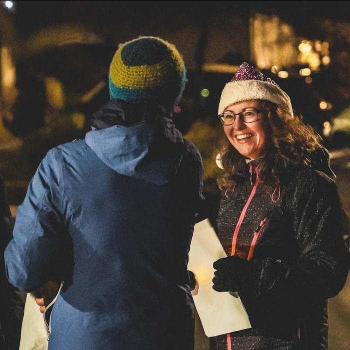 People chatting outdoors at night