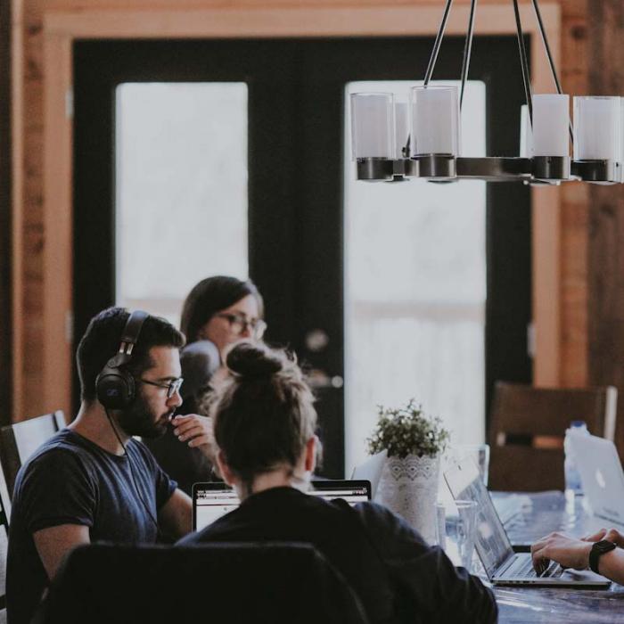 A group of work colleagues sitting around a table